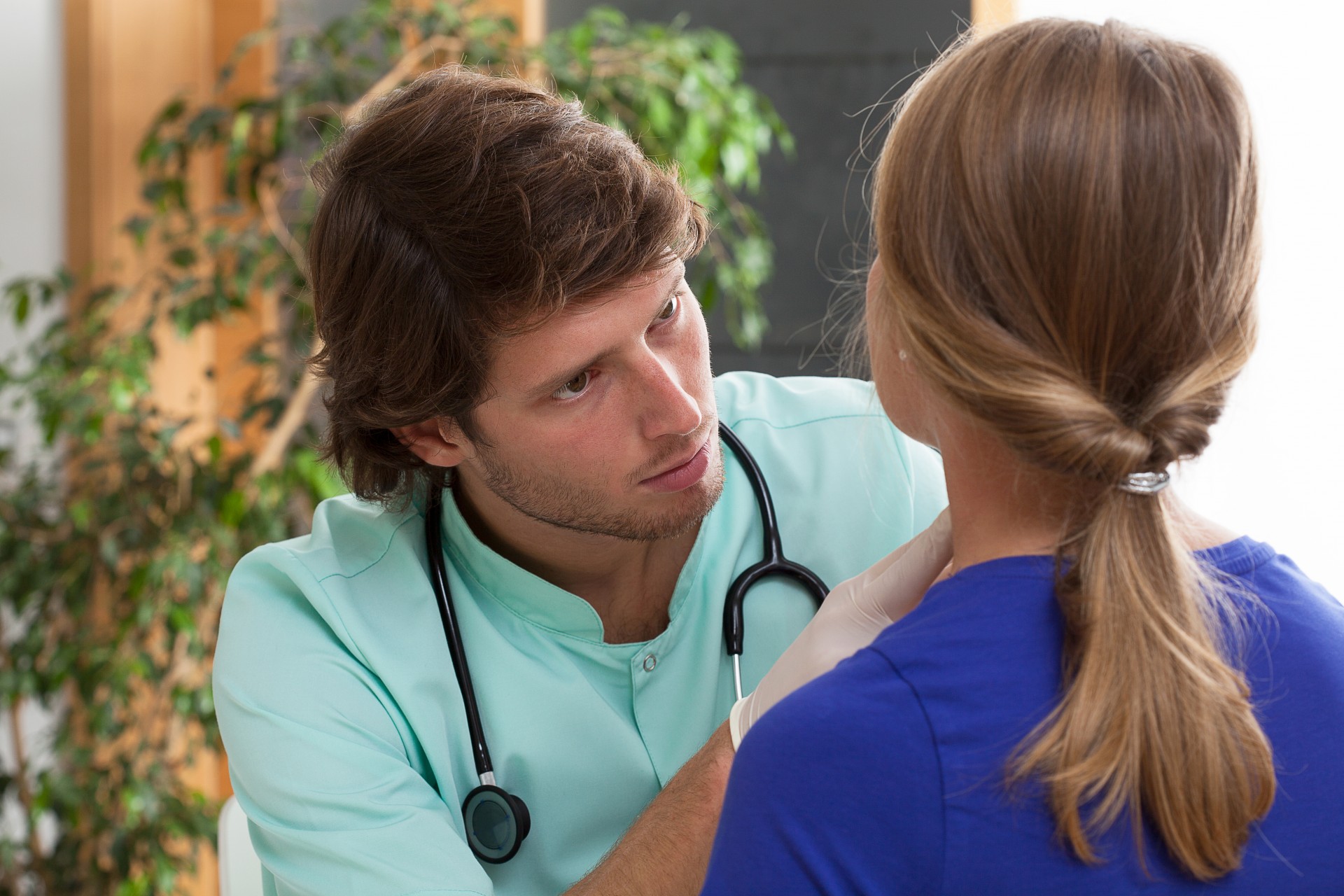 Doctor examining patient